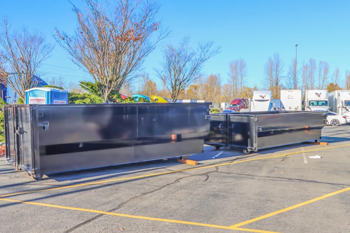 Professional dumpster rental service with roll-off container on residential driveway in Gardnerville Ranchos